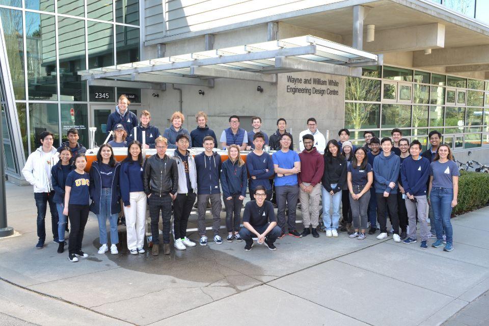 Sailbot team photo with Raye outside of the Engineering Design Centre