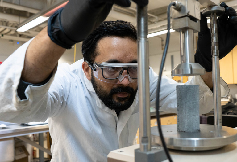 Advanced Geomaterials Testing Lab member using research equipment