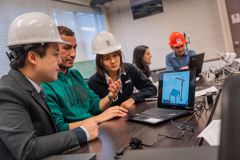 Dr. Tony Yang and students discuss modular construction