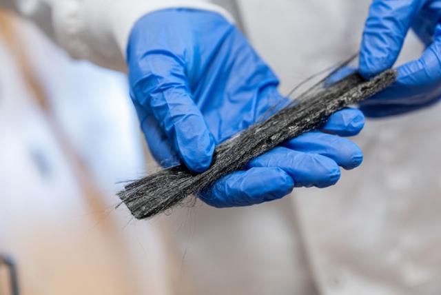 Finished carbon fibers derived from bitumen. 
