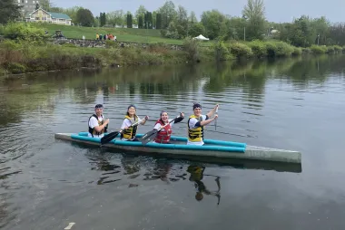 Team members on the concrete canoe