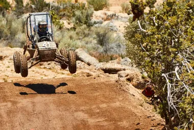ATV in the air on a dirt track at the SAE California competition.