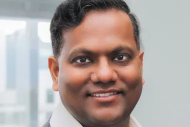 Dr. Shekhar smiling at the camera