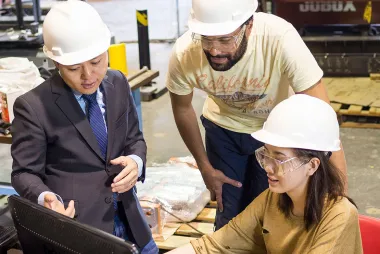 Engineers working on a computer
