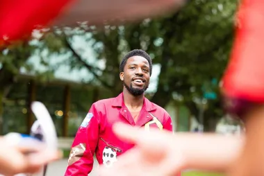 Engineering student in red jump suit at UBC Imagine Day