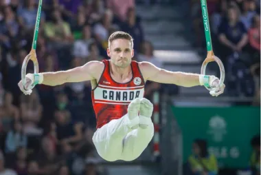 Zack Eberwein on the rings competing at the Olympics