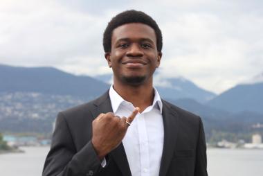 UBC CHBE student Kenechukwu Ene holding up his pinky to showcase his iron ring.