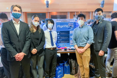 PhysViz poster and the 5 team members standing around it.