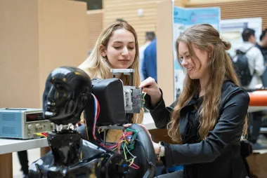 Two students working on a robot
