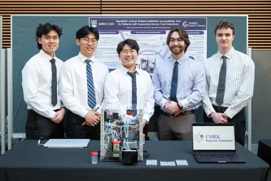 Students standing in front of their project