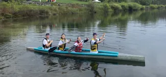 Team members on the concrete canoe