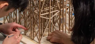 EERI Seismic Design Team members working on a wood structure prototype