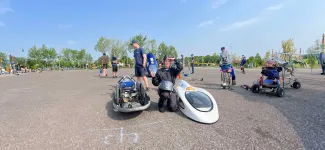 Team member with prototype vehicle