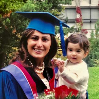 Roz Seyednejad EMBA graduation with seven-month-old daughter