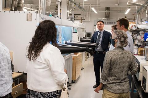 people in a lab looking at a discovery