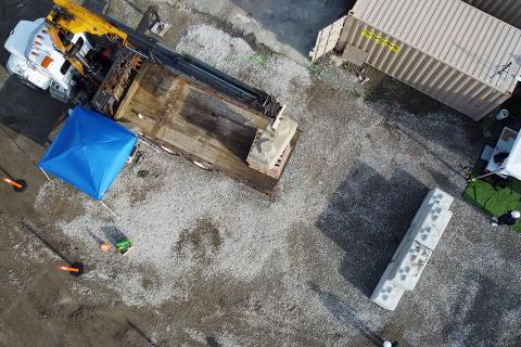 Aerial view of a smart construction robot tasked to build a wall