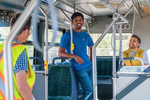 A student in UBC Okanagan’s Lifecycle Management Lab poses on a bus.