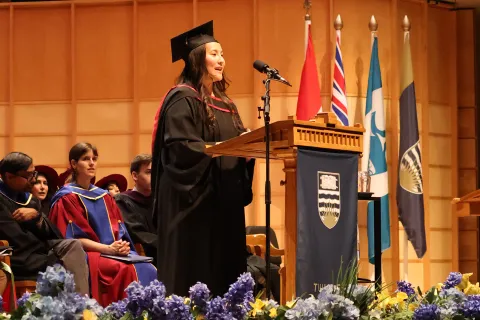 Nomi Danzig speaks on stage at graduation