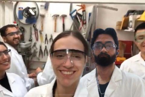 The team working in the lab all smiles
