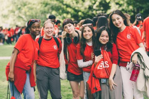 A group of students standing and smiling