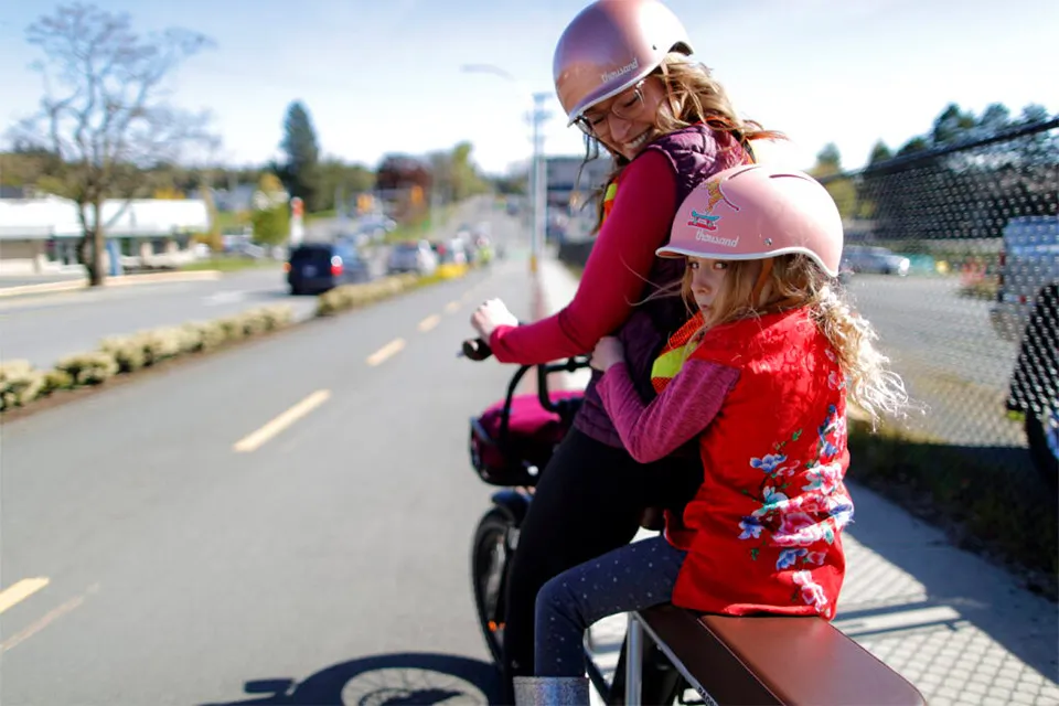 Two people on an e-bike