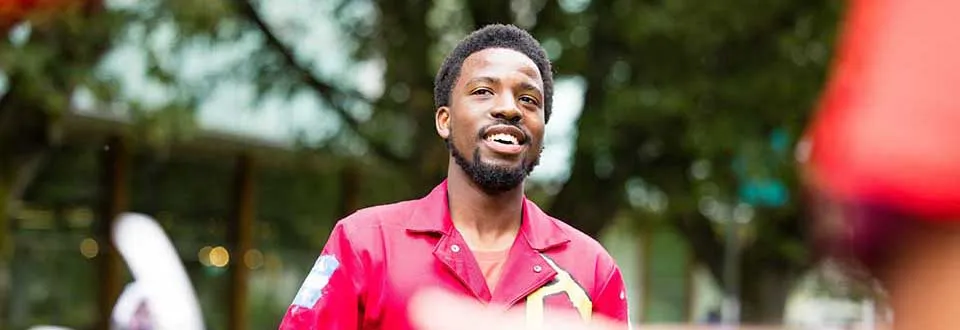Engineering student in a red jumpsuit.