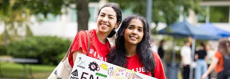 Two female engineering students smiling