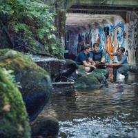 UBC environmental engineering students taking a reading in an urban creek.
