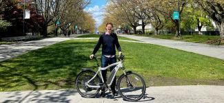 Dr. Bigazzi poses with an e-bike at UBC